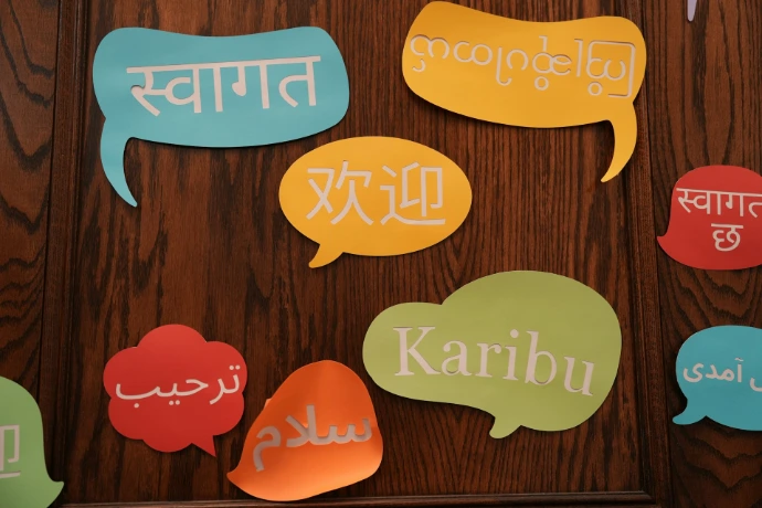 A group of colorful speech bubbles on a wooden wall